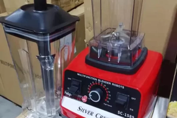 making a milkshake using a hand blender